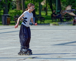 Little girl rollerblading